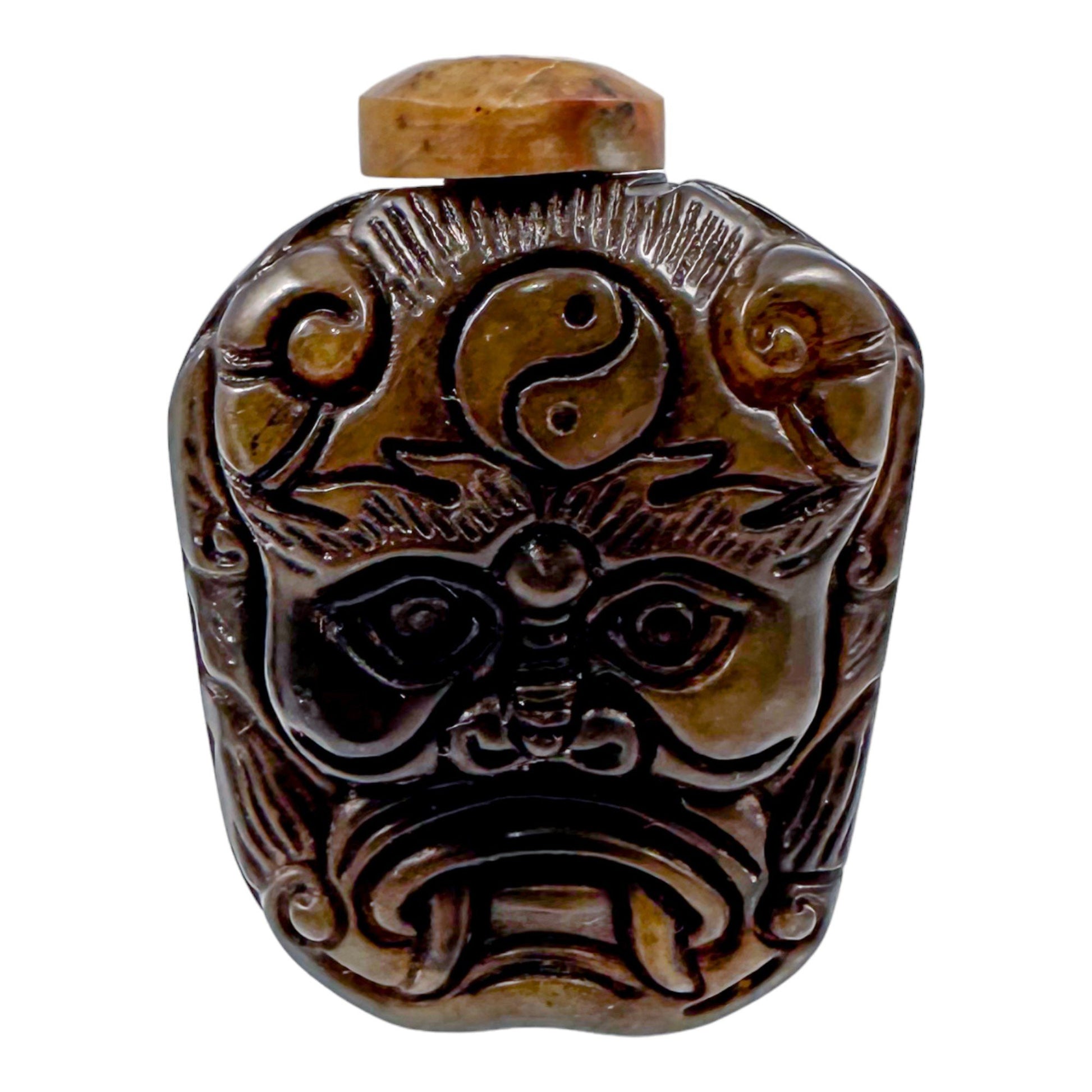 Qing Dynasty jade snuff bottle with demon mask and Yin/Yang symbol