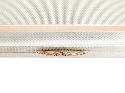 Silver matching cigarette case and powder compact with 9ct rose gold bands and letter "A"