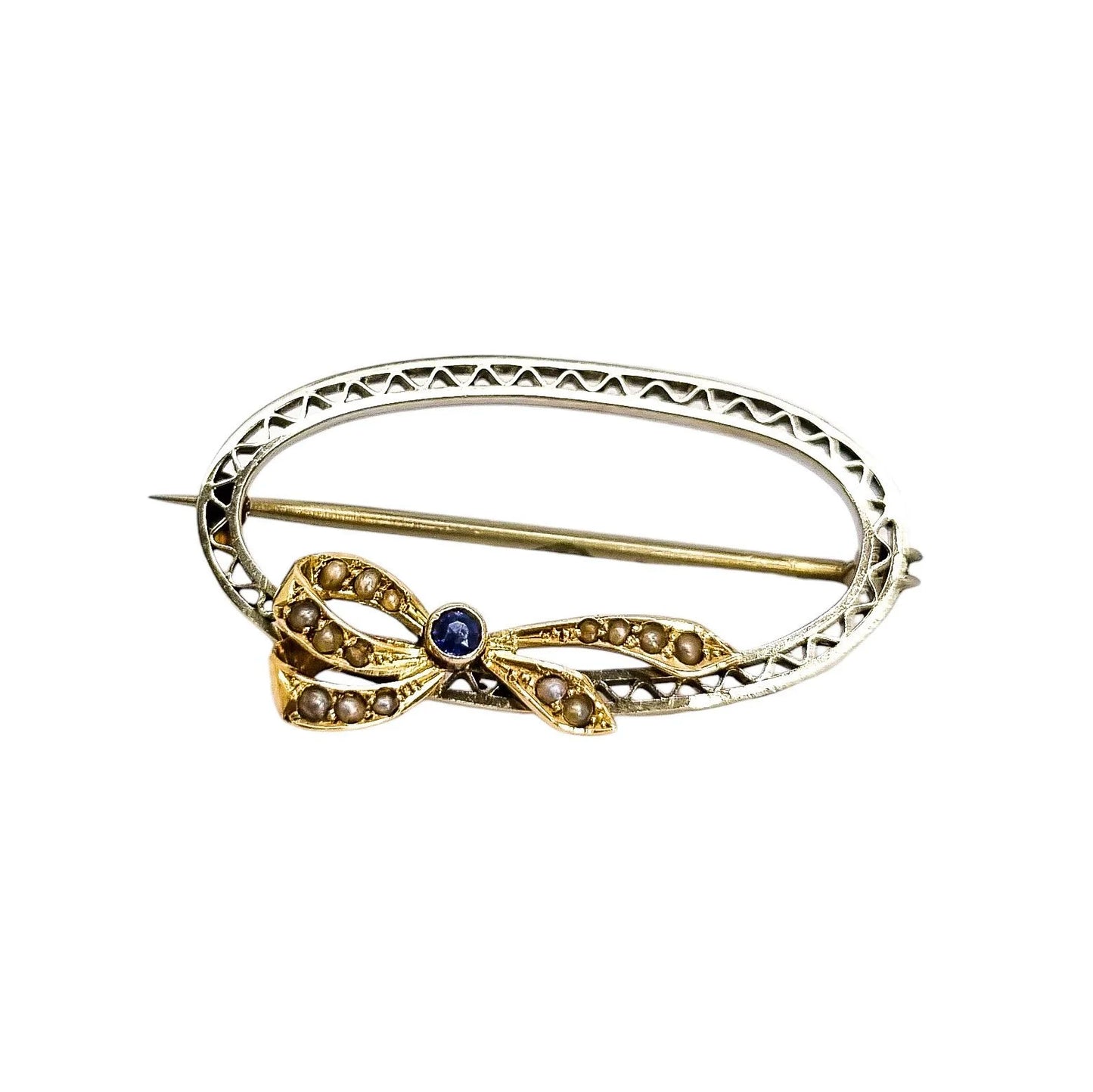 Antique 9ct gold oval openwork brooch with sapphire and seed pearl bow