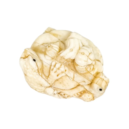 Meiji period Japanese bone signed okimono / netsuke, two toads and snake on pumpkin