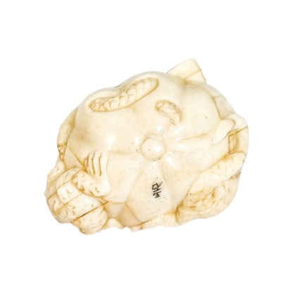Meiji period Japanese bone signed okimono / netsuke, two toads and snake on pumpkin