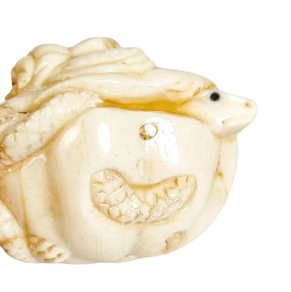 Meiji period Japanese bone signed okimono / netsuke, two toads and snake on pumpkin