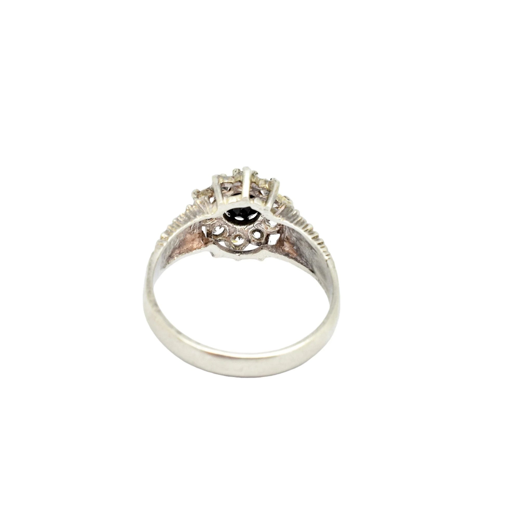 Sterling silver sapphire flower halo cluster ring in Brutalist style, size P