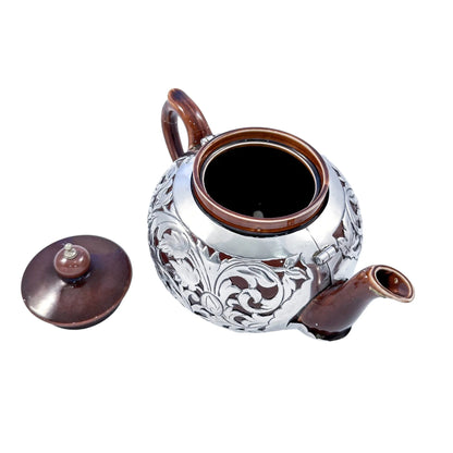 Art Nouveau Lenox brown teapot, stand and creamer with sterling silver overlay