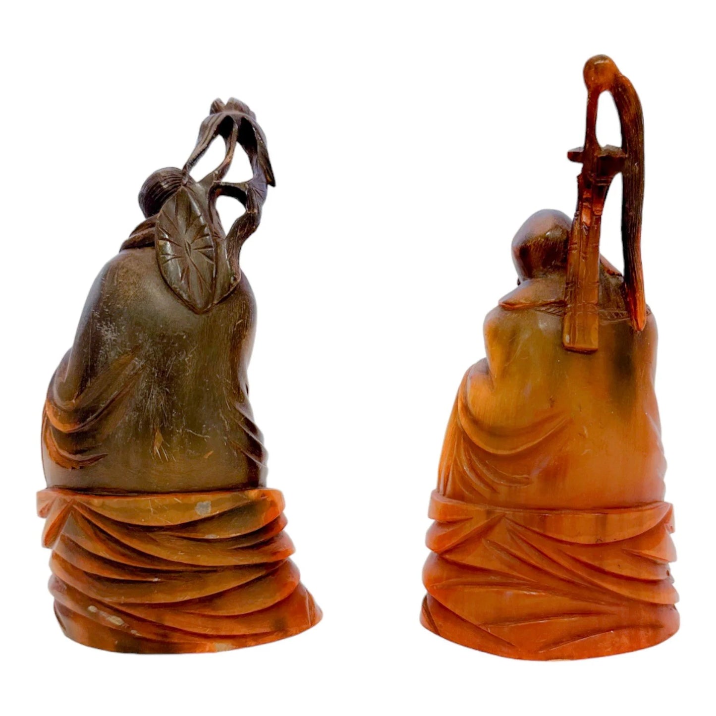 Antique Chinese pair of Immortals / Deities carved in buffalo horn, holding a staff and a lotus flower
