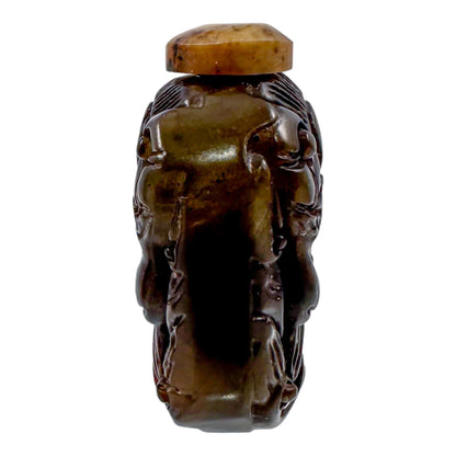 Qing Dynasty jade snuff bottle with demon mask and Yin/Yang symbol