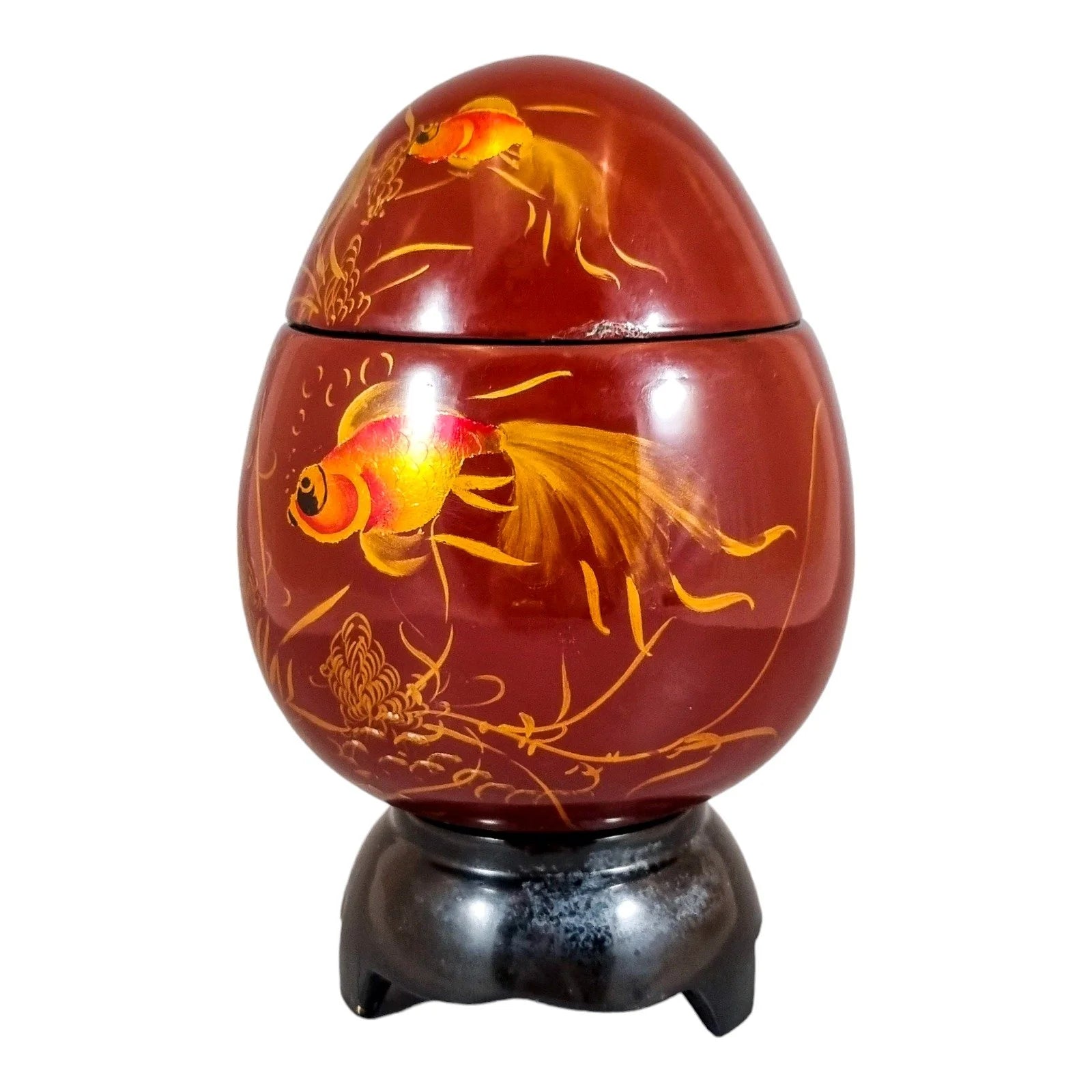 Egg-shaped large red lacquerware box on stand, gilded and painted with angelfish