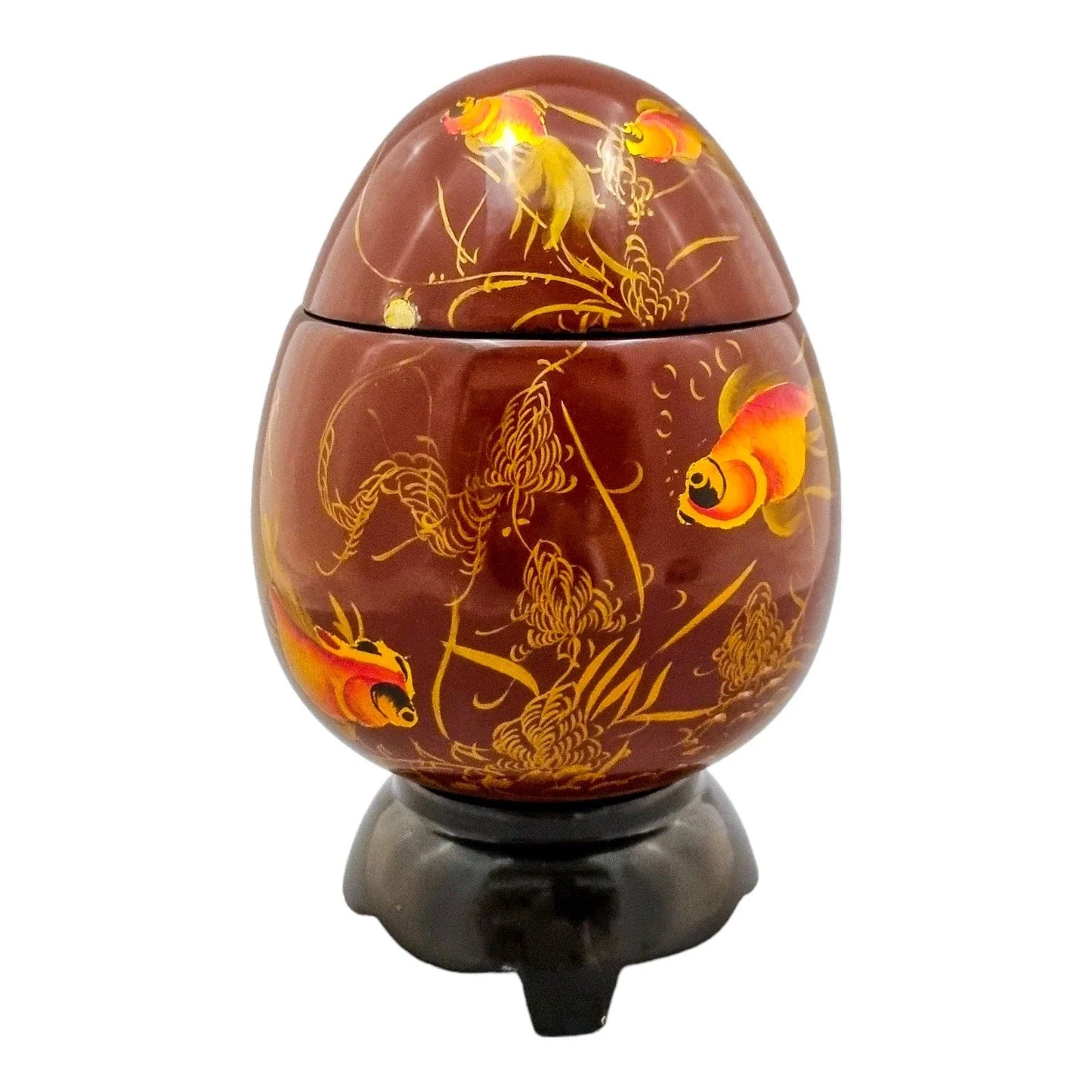 Egg-shaped large red lacquerware box on stand, gilded and painted with angelfish