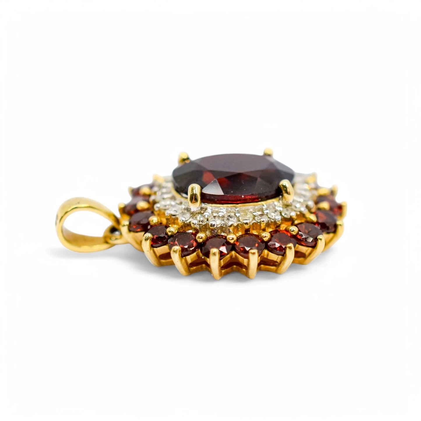 Vintage 9ct gold pendant with oval garnet, diamond halo, and garnet cluster