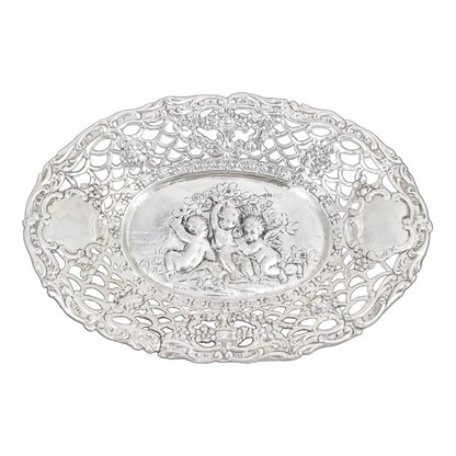 German silver pierced bonbon trinket dish with repousse cherubs and floral garlands