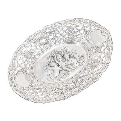 German silver pierced bonbon trinket dish with repousse cherubs and floral garlands