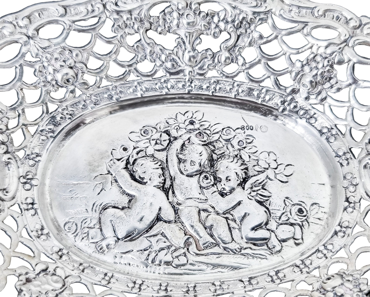German silver pierced bonbon trinket dish with repousse cherubs and floral garlands