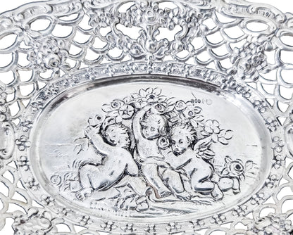 German silver pierced bonbon trinket dish with repousse cherubs and floral garlands