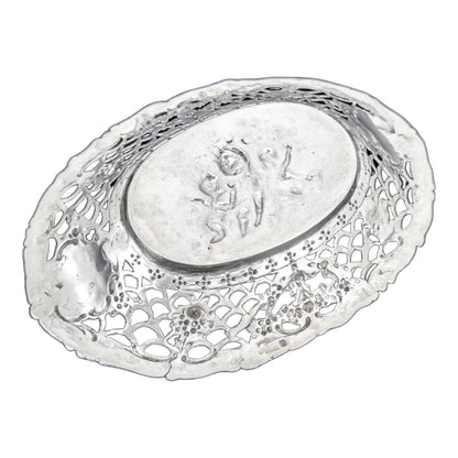 German silver pierced bonbon trinket dish with repousse cherubs and floral garlands