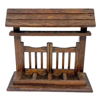 Vintage novelty oak 4-pipe rack stand in the form of a fence with roof on top