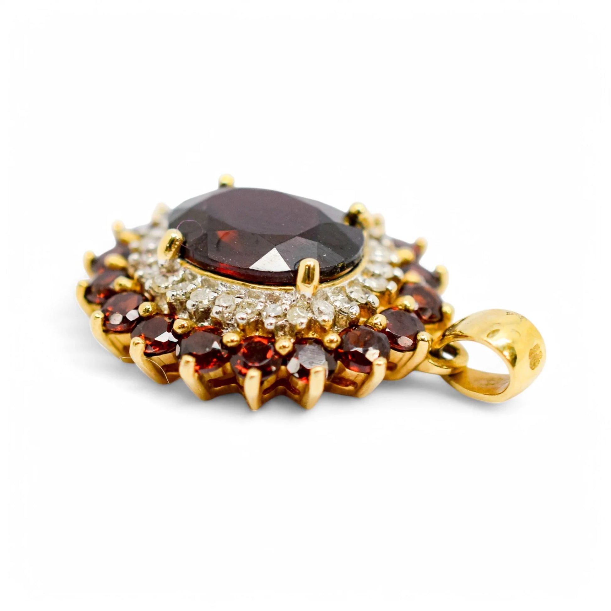 Vintage 9ct gold pendant with oval garnet, diamond halo, and garnet cluster