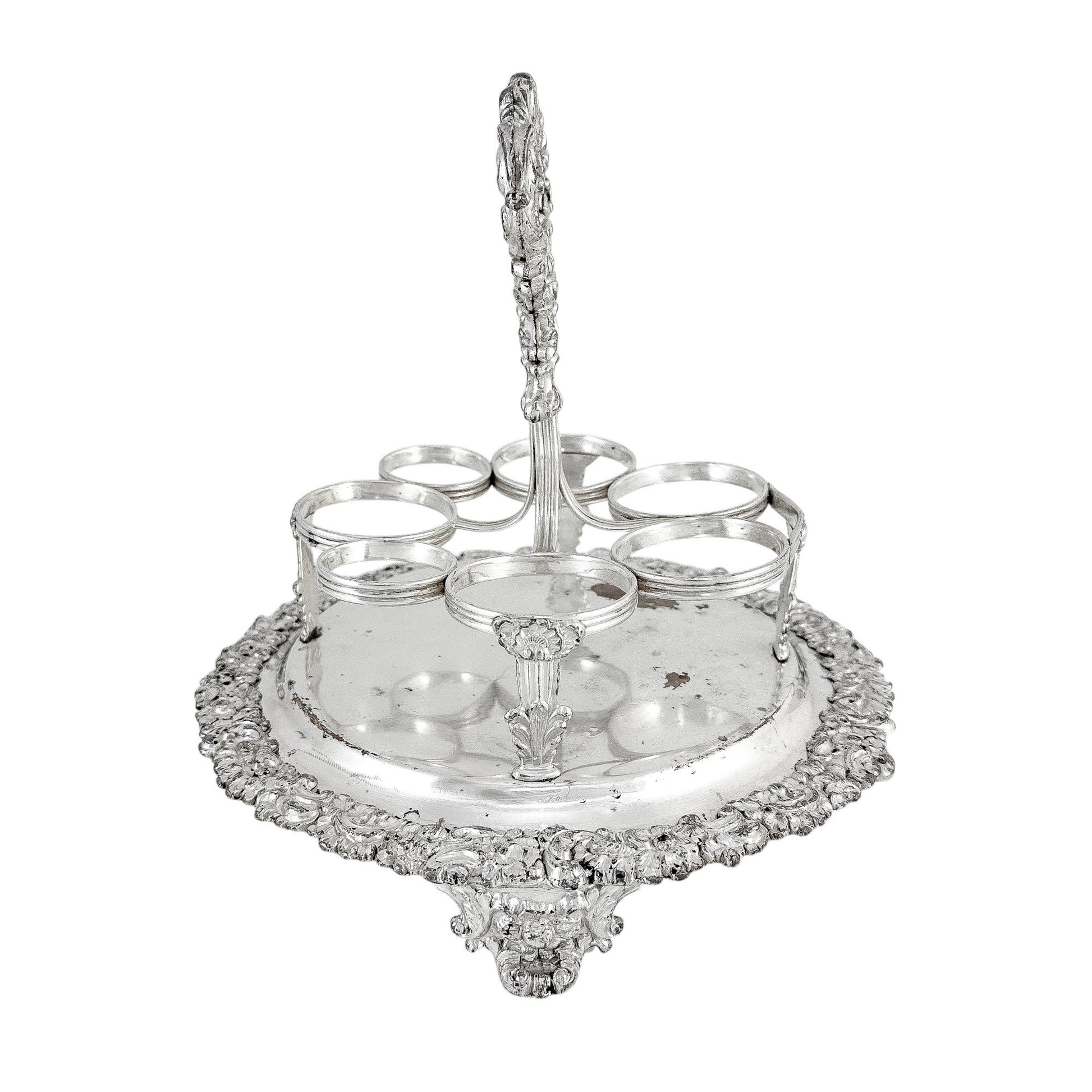 George III Old Sheffield silver plate cruet stand for 7 bottles, raised on paw feet