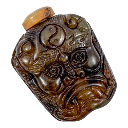 Qing Dynasty jade snuff bottle with demon mask and Yin/Yang symbol