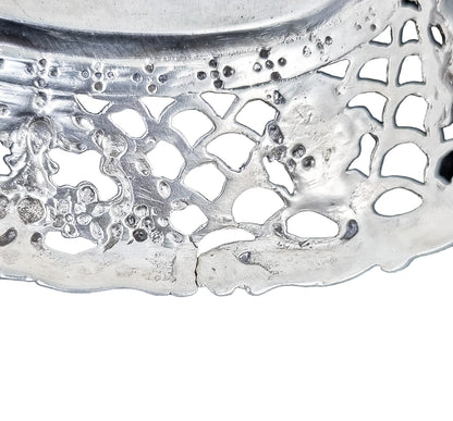 German silver pierced bonbon trinket dish with repousse cherubs and floral garlands