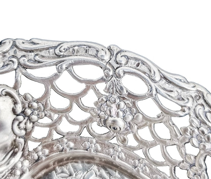 German silver pierced bonbon trinket dish with repousse cherubs and floral garlands