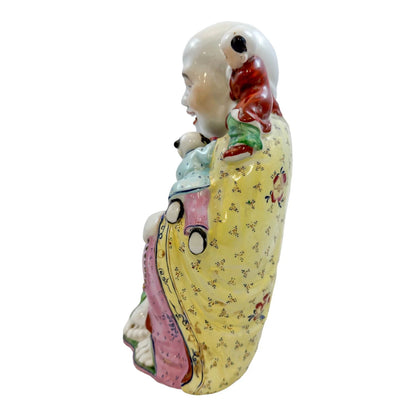 Vintage Chinese porcelain laughing Buddha figurine with children, a symbol of fertility