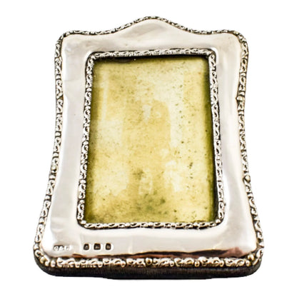Edwardian sterling silver easel photo frame trimmed with scrolls