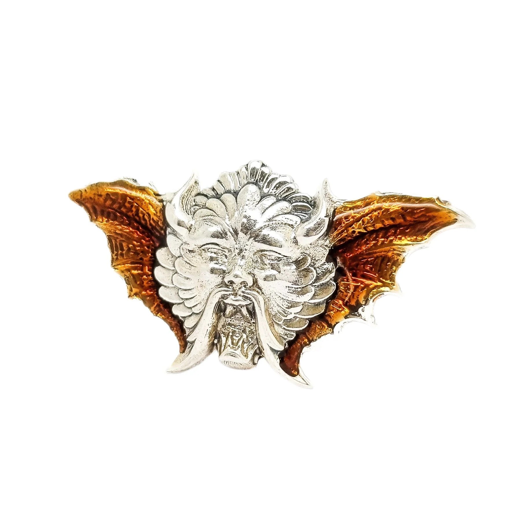 Quirky winged devil face brooch in sterling silver and orange enamel