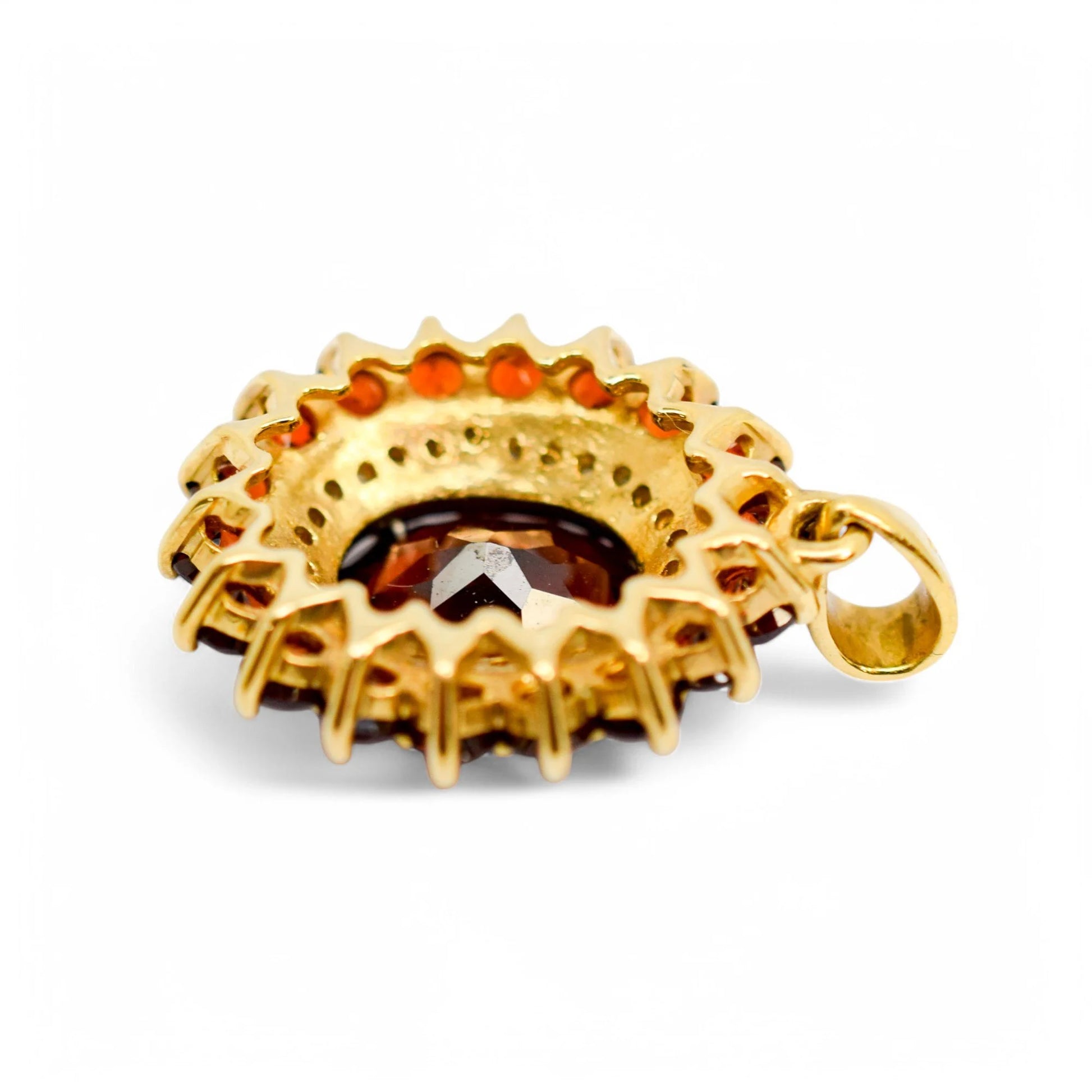 Vintage 9ct gold pendant with oval garnet, diamond halo, and garnet cluster
