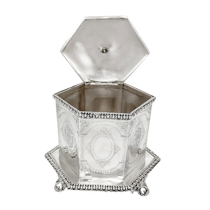 Victorian Neoclassical 6-sided silver-plated biscuit barrel on cast feet with egg-and-dart trim