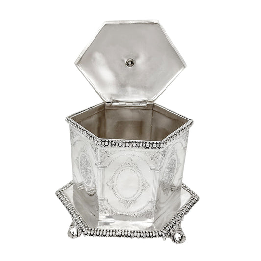 Victorian Neoclassical 6-sided silver-plated biscuit barrel on cast feet with egg-and-dart trim