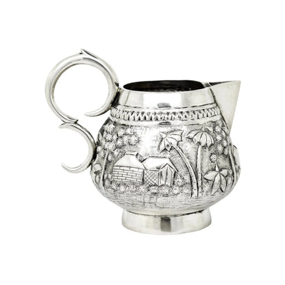Colonial Raj Calcutta silver milk jug / creamer embossed with village scenes