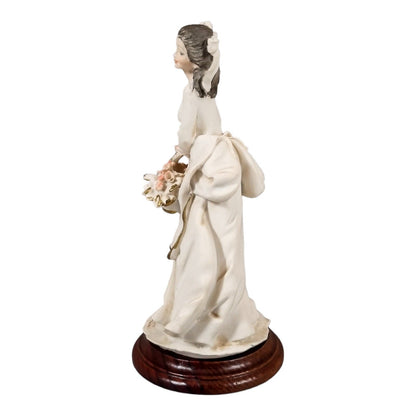 A. Belcari Capodimonte figurine of a young woman holding a flower basket