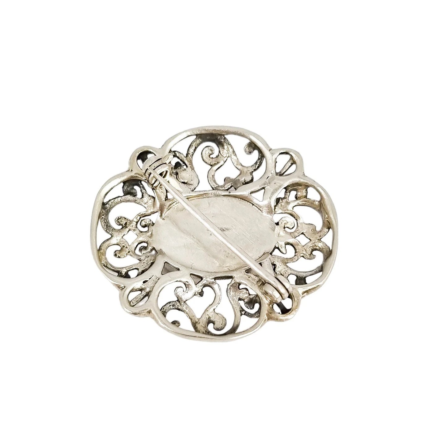 Art Deco sterling silver onyx openwork scrolling brooch