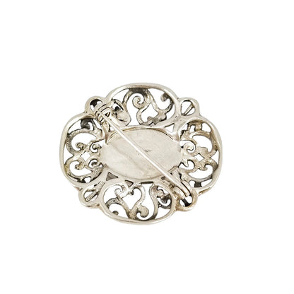 Art Deco sterling silver onyx openwork scrolling brooch