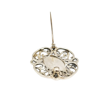 Art Deco sterling silver onyx openwork scrolling brooch