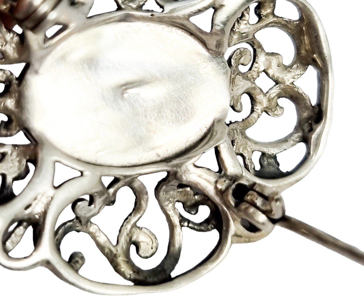 Art Deco sterling silver onyx openwork scrolling brooch