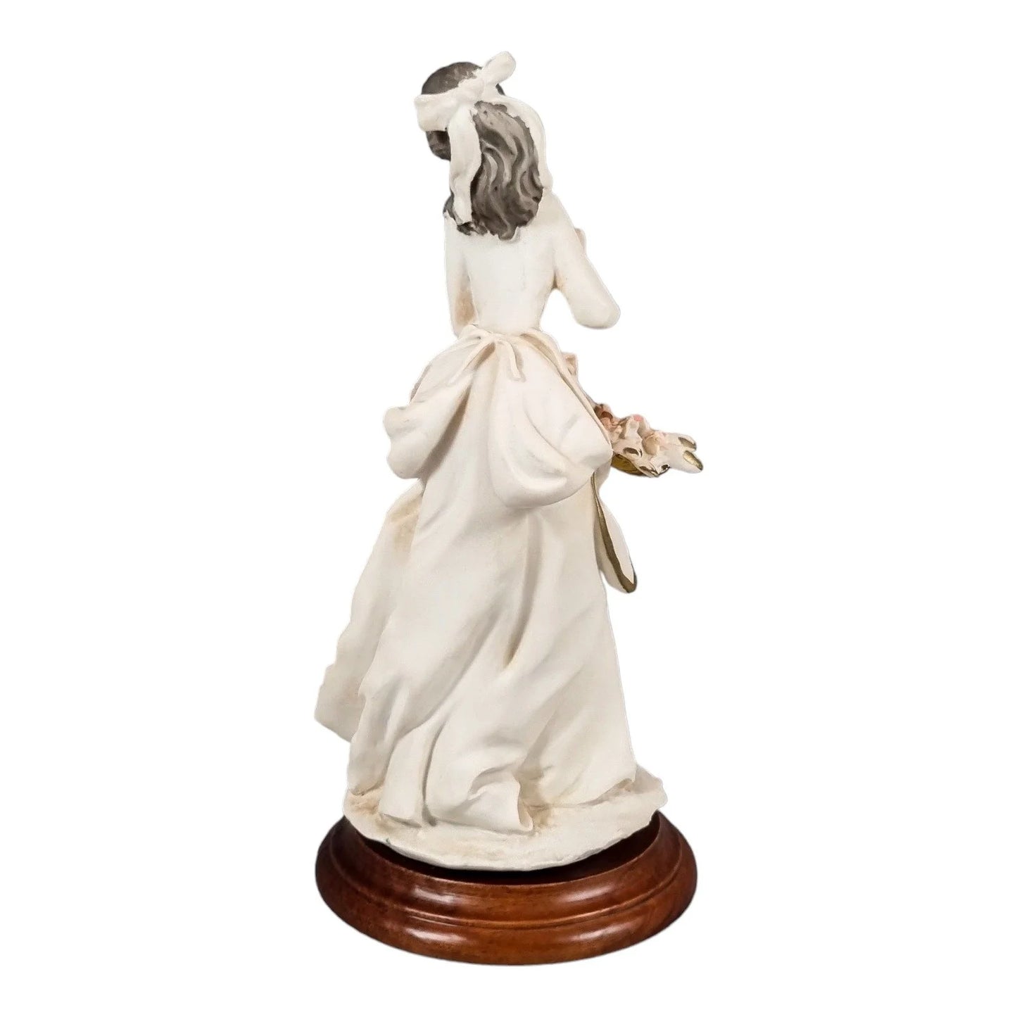 A. Belcari Capodimonte figurine of a young woman holding a flower basket
