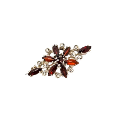Art Deco openwork silver floral brooch set with red garnets and marcasites