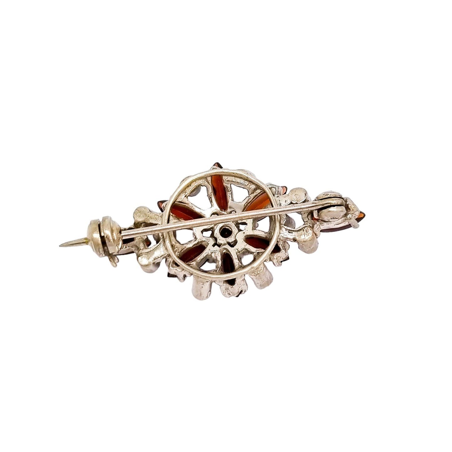 Art Deco openwork silver floral brooch set with red garnets and marcasites