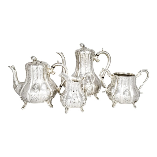 1860’s silverplate 4 piece tea and coffee set with nut finials and embossed flowers