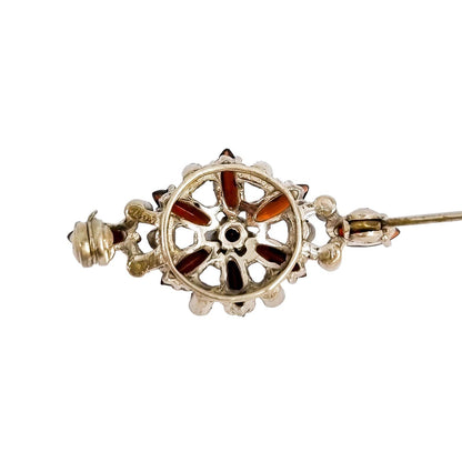 Art Deco openwork silver floral brooch set with red garnets and marcasites