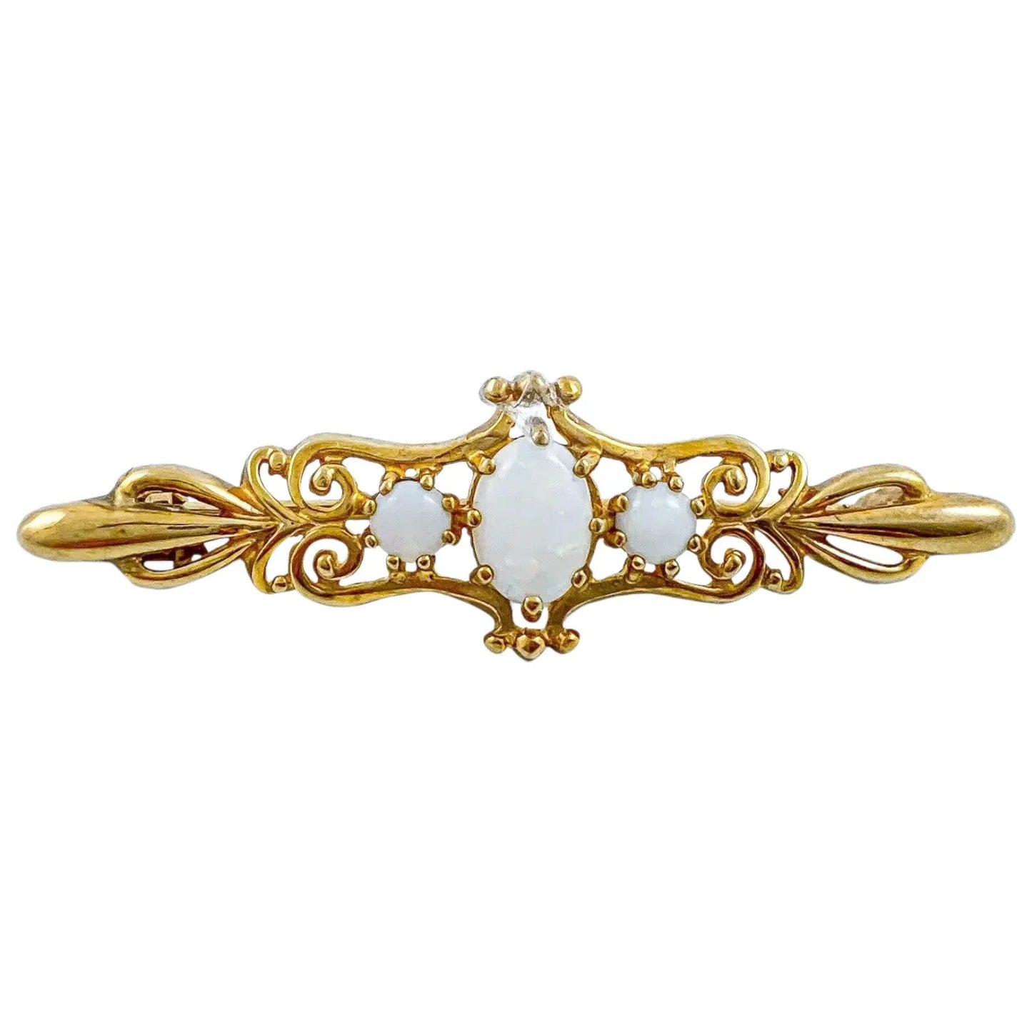 Art Nouveau style yellow gold brooch set with cabochon opals in a scrolling design