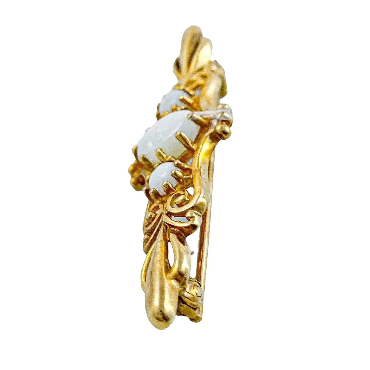 Art Nouveau style yellow gold brooch set with cabochon opals in a scrolling design