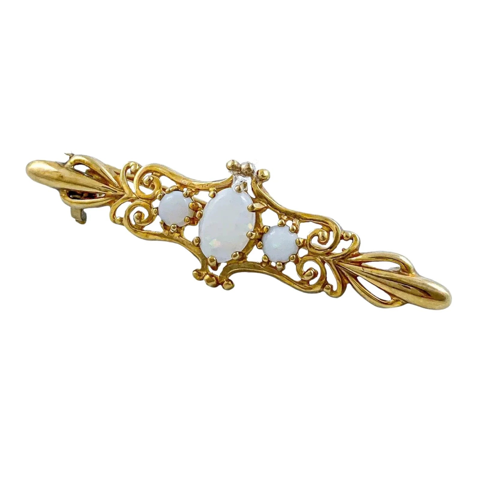 Art Nouveau style yellow gold brooch set with cabochon opals in a scrolling design