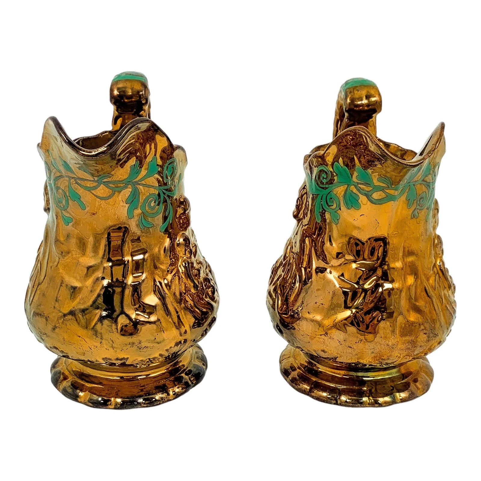 Pair of Victorian pottery copper lustreware moulded jugs / pitchers with religious scenes and snake handles