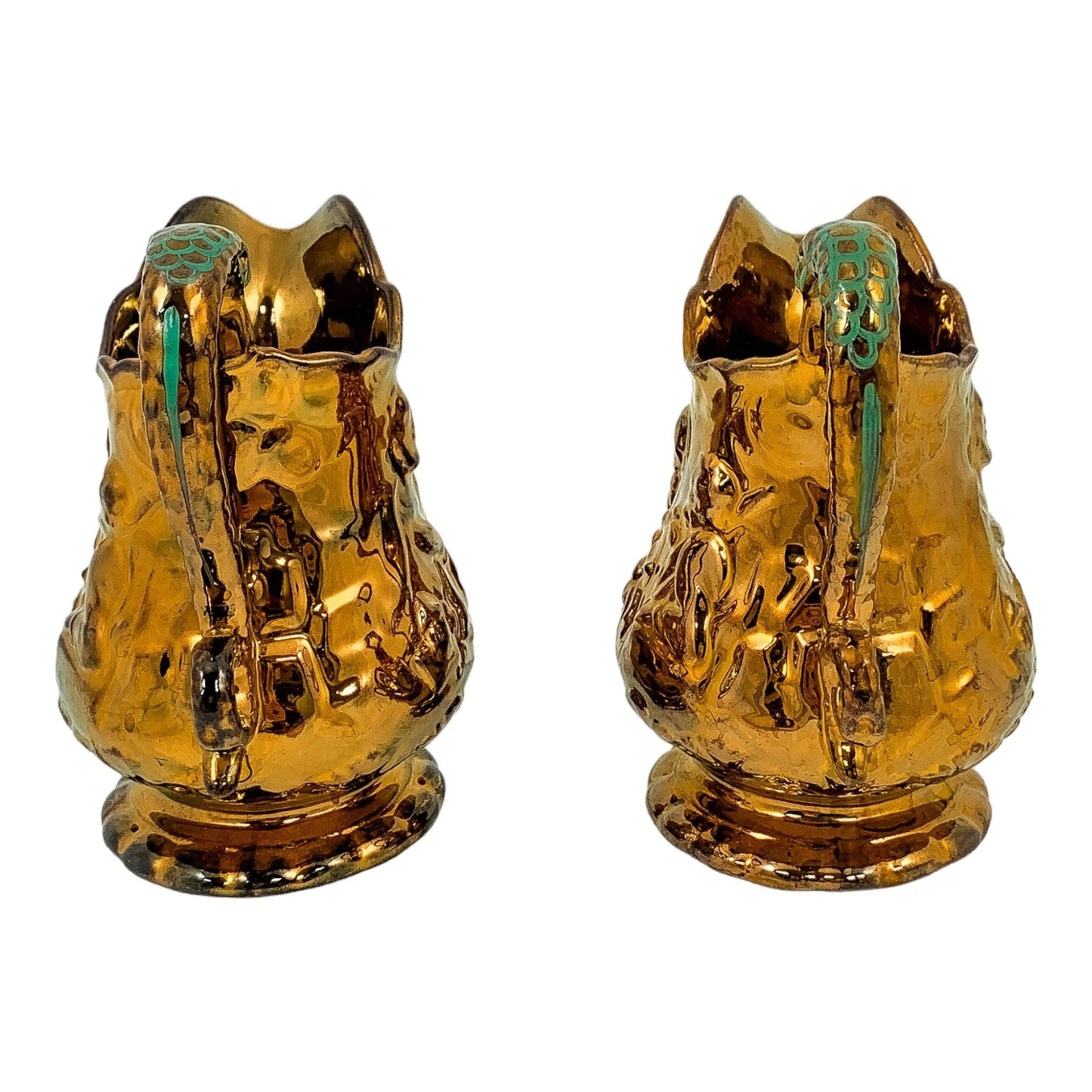 Pair of Victorian pottery copper lustreware moulded jugs / pitchers with religious scenes and snake handles