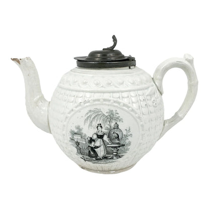 1820's Georgian moulded creamware teapot with black transfer print panels of lady with a birdcage