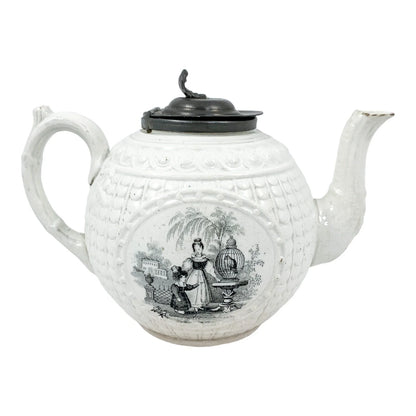 1820's Georgian moulded creamware teapot with black transfer print panels of lady with a birdcage