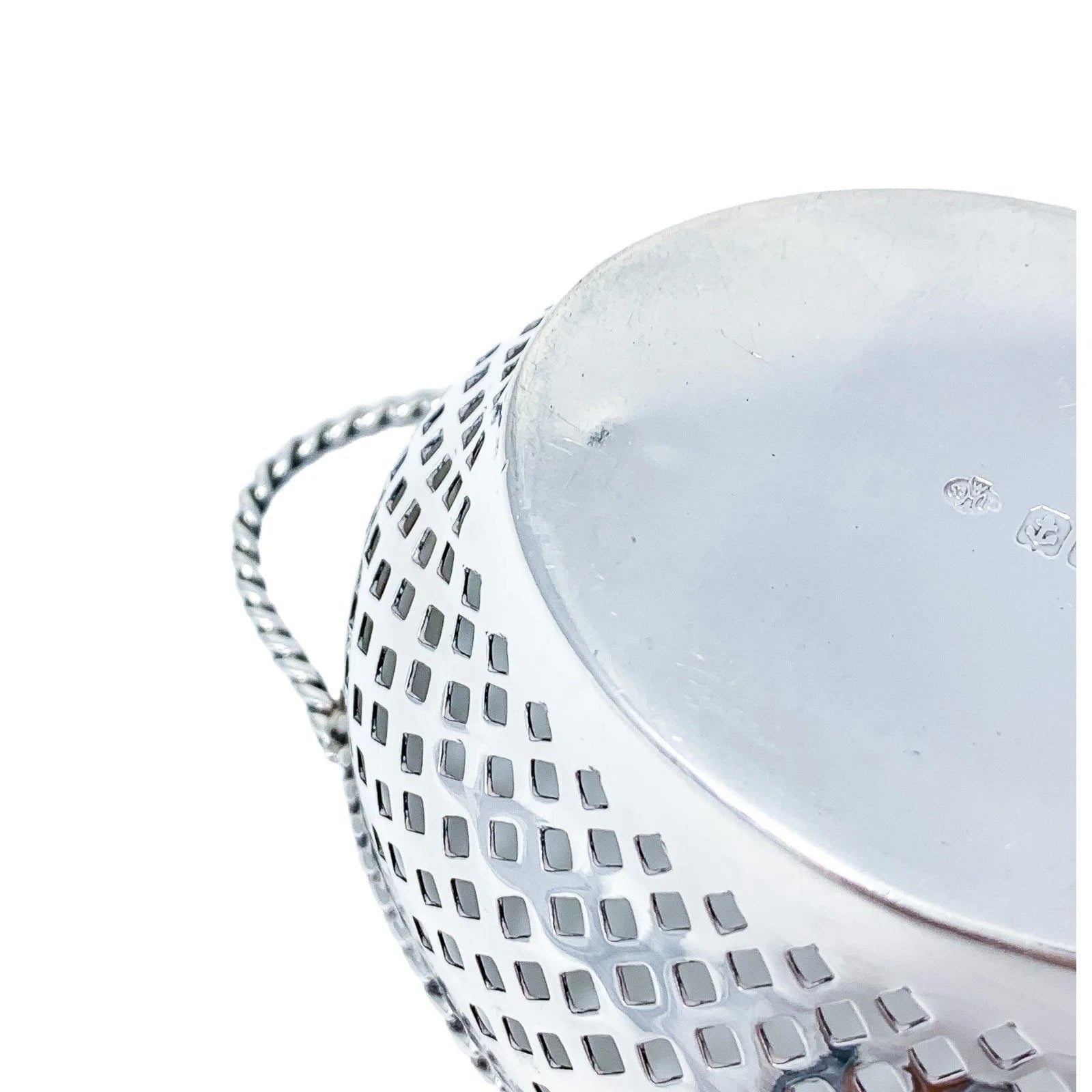 Edwardian sterling silver bonbon baskets with C-form handles and pierced geometric design