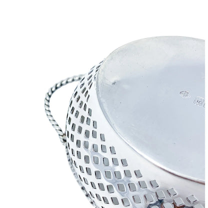 Edwardian sterling silver bonbon baskets with C-form handles and pierced geometric design